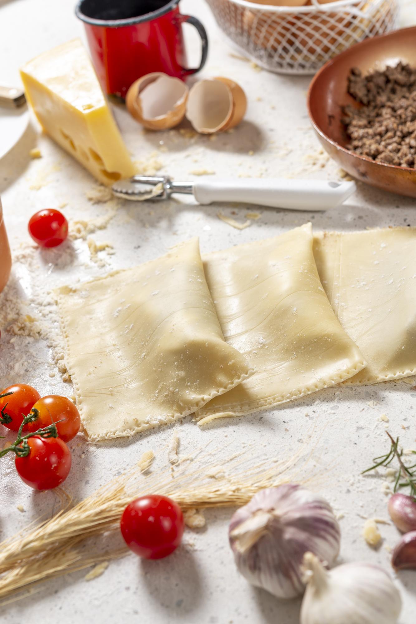 Hand-rolled ravioli on wooden board